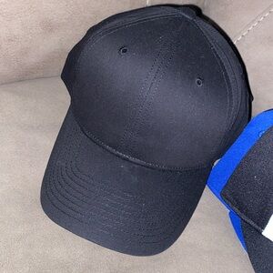 9 solid black baseball caps